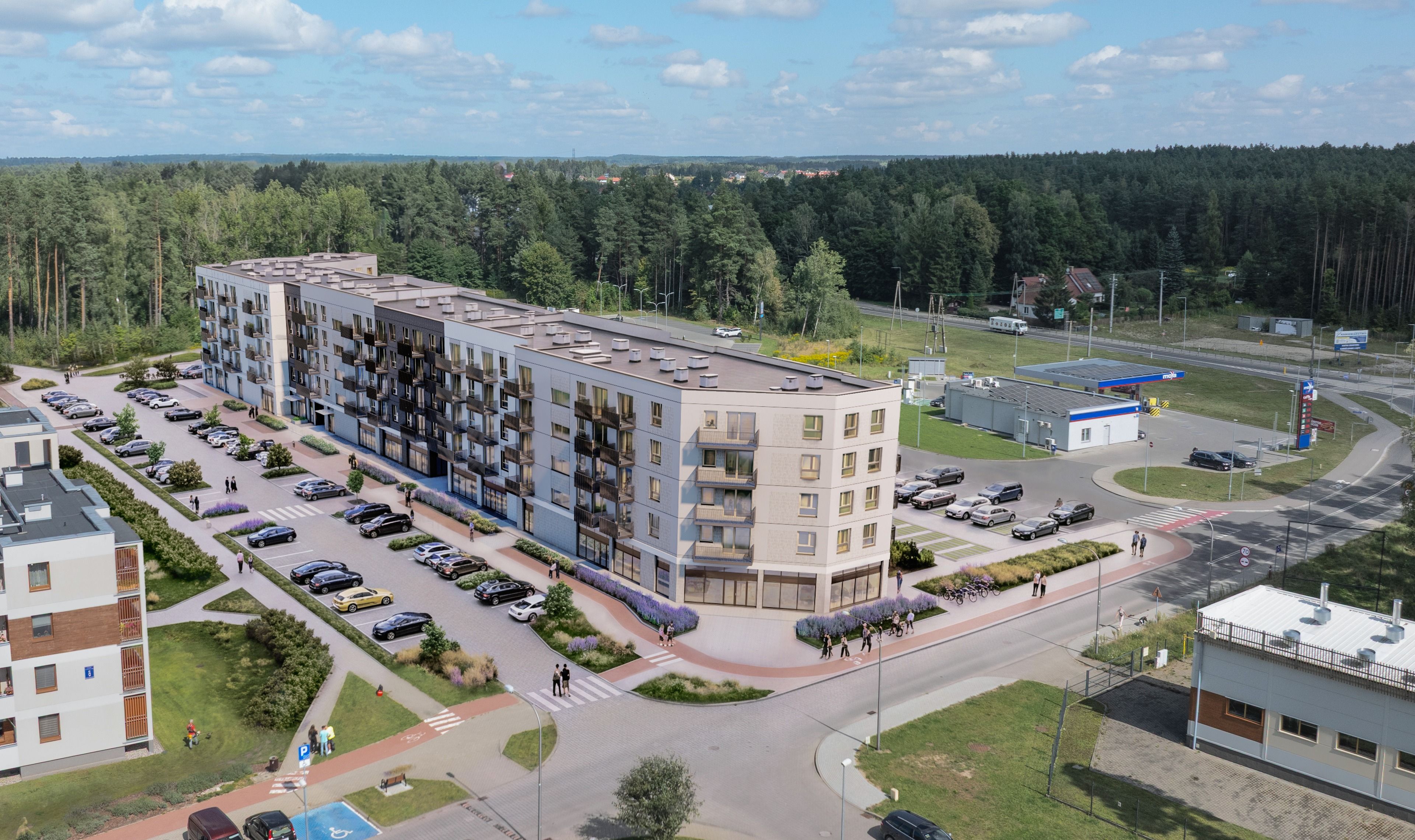 Budynek S19 z lotu ptaka, parter z lokalami usługowymi, wokół las